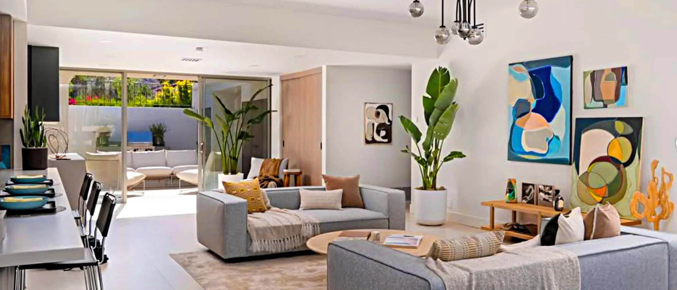 The same room staged with gray sofas and colorful Lynda Keeler abstracts, Seven Lakes, Palm Springs