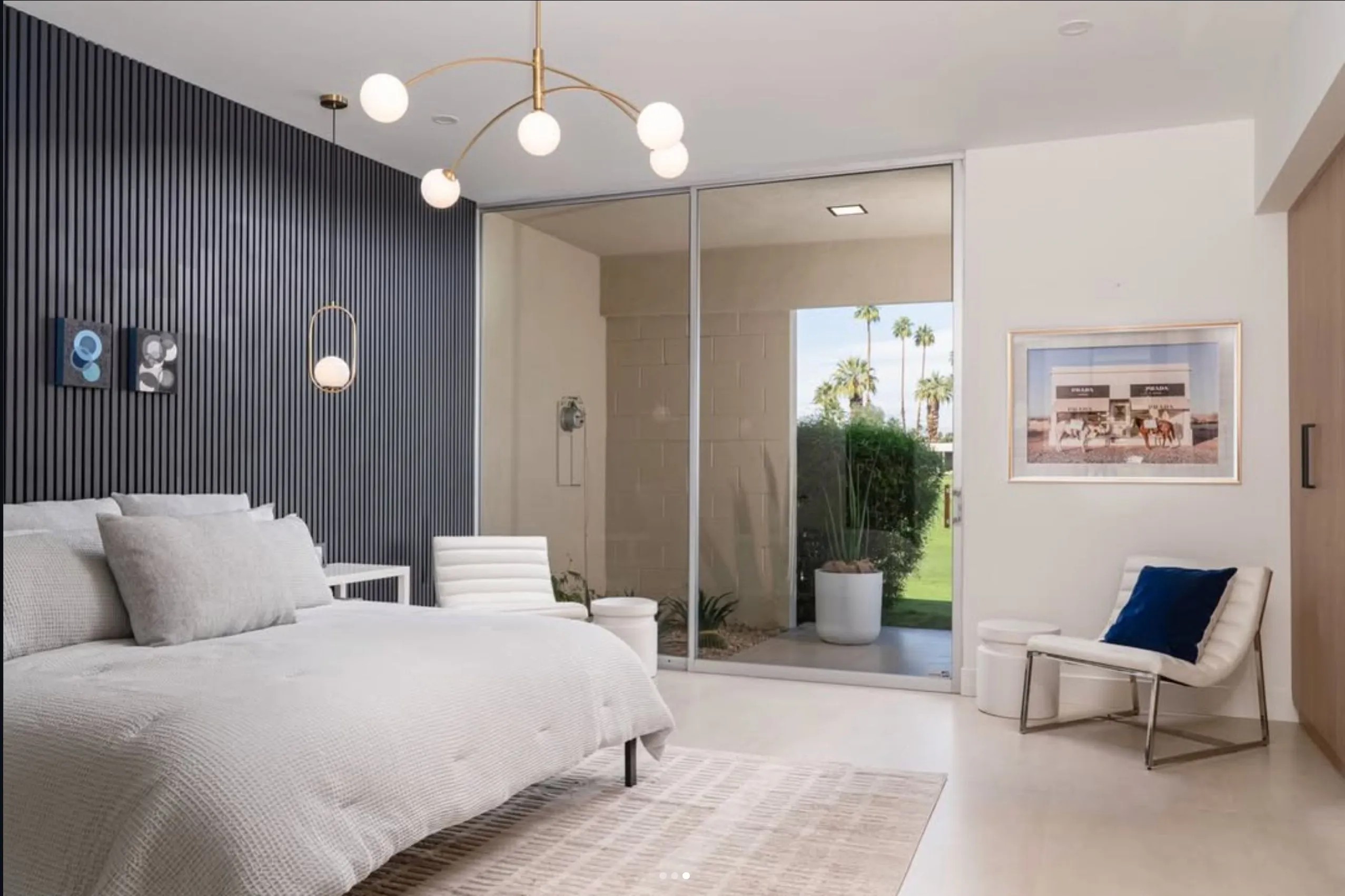 Staged bedroom with navy slat wall, Prada Marfa photograph by Gray Malin, Seven Lakes