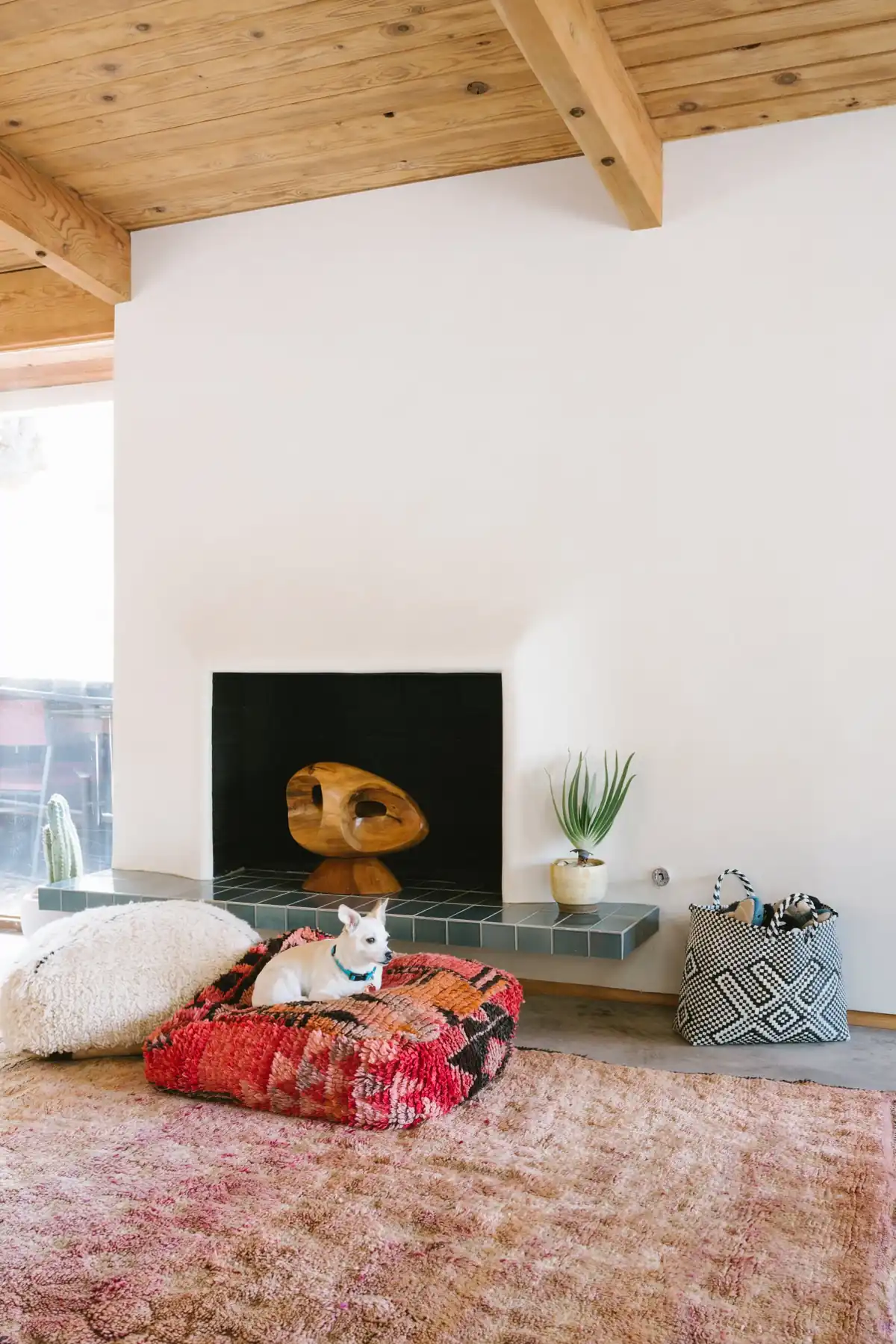 Fireplace with sculptural hearth and vintage textile, Bel Air