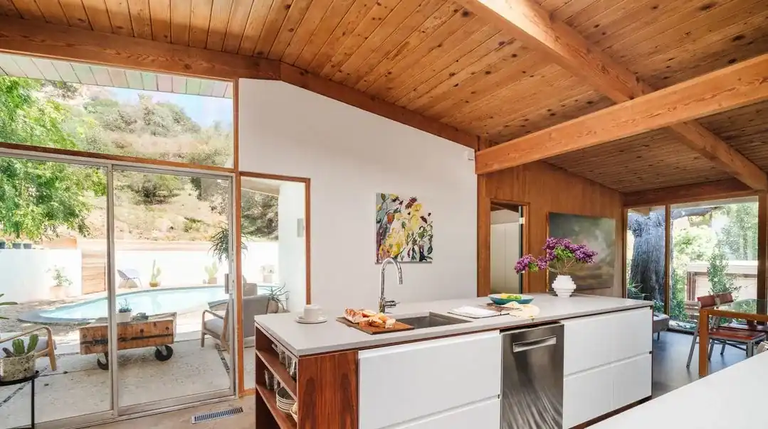 Kitchen with walnut island and pool view, Bill Mack home, Bel Air