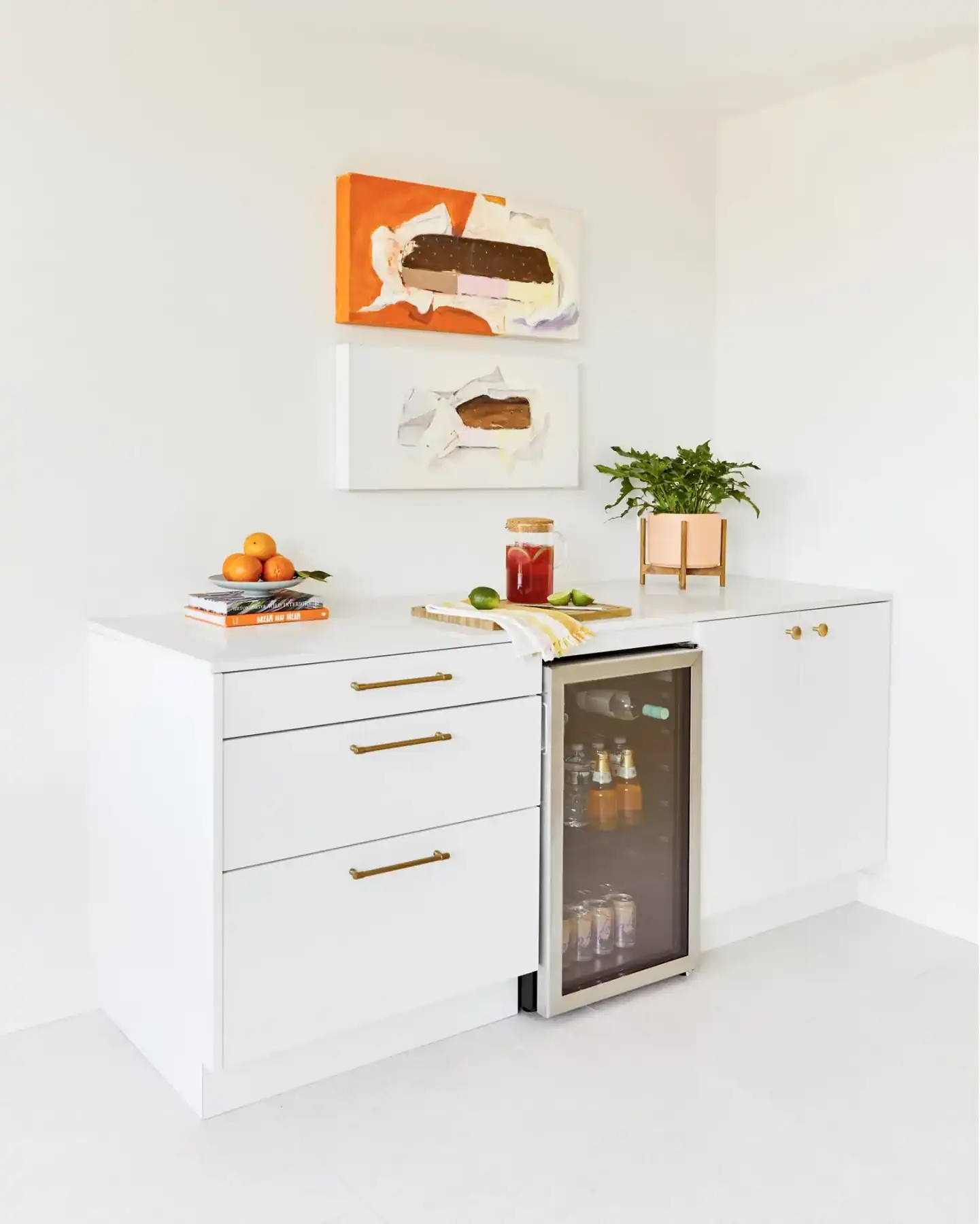 Bar with beverage fridge and two ice cream sandwich paintings by Christa Martin, Sandpiper condo, Palm Desert