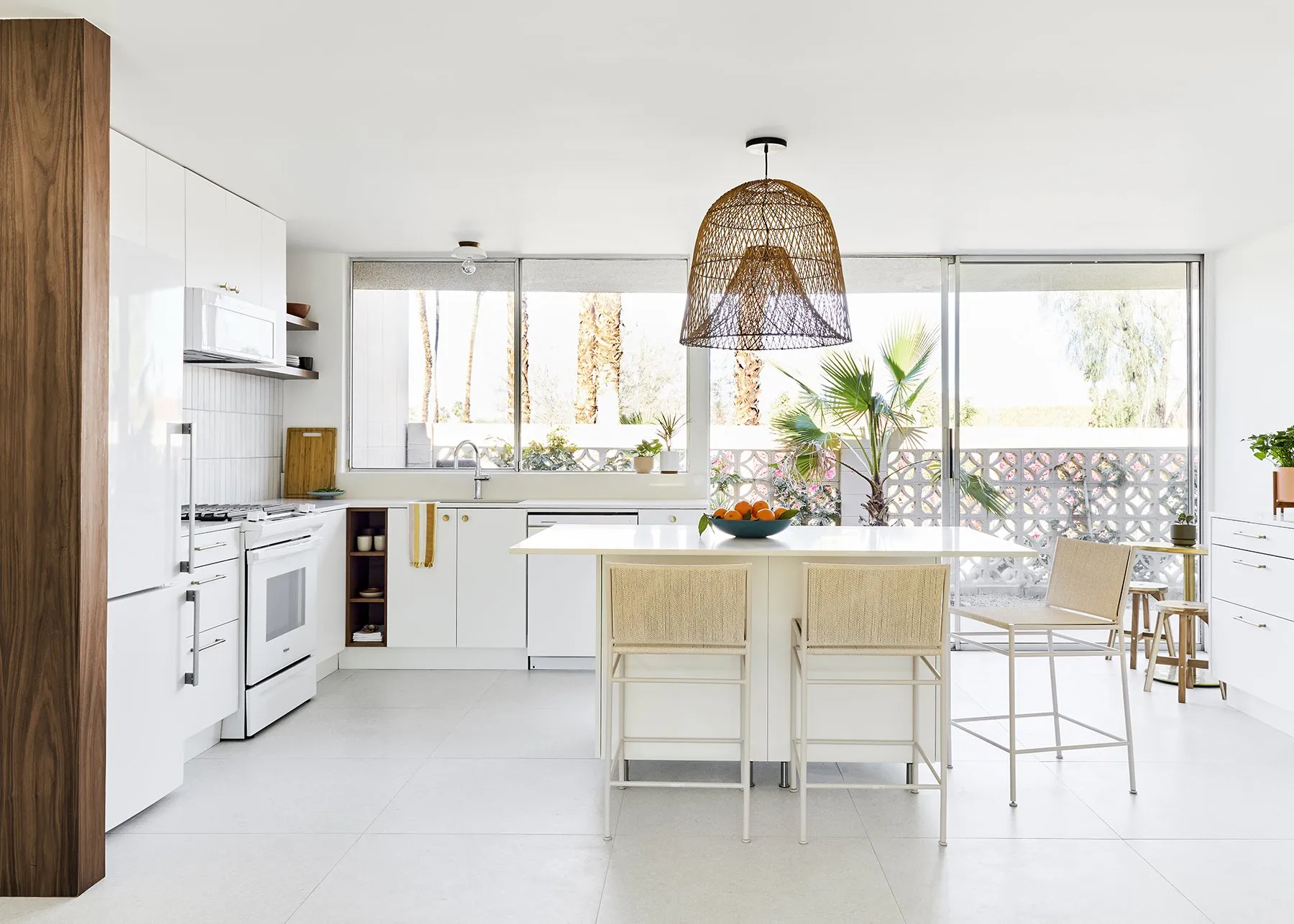 Rebuilt kitchen with island and breeze block beyond, William Krisel condo, Sandpiper, Palm Desert