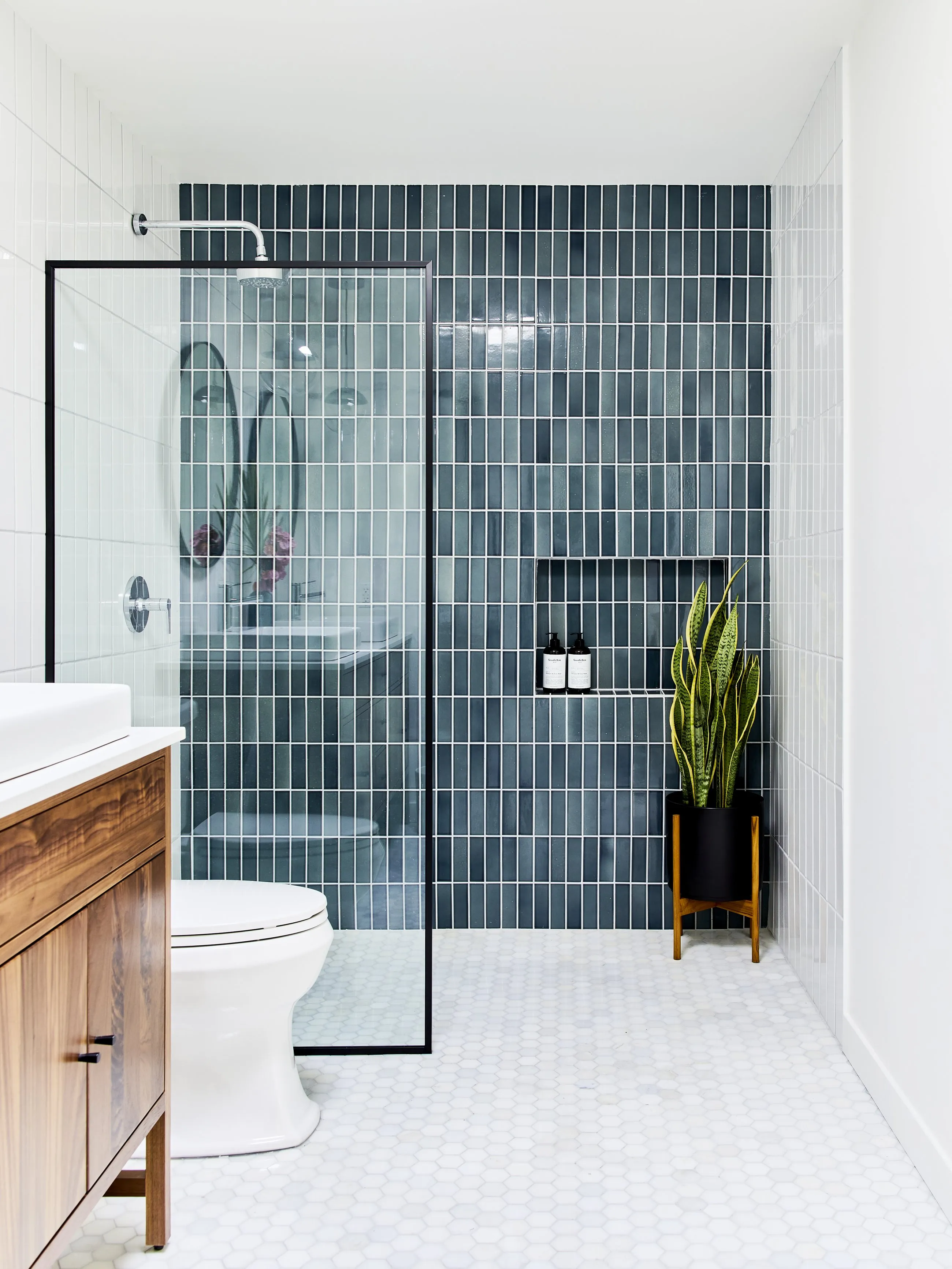 Blue tile walk-in shower with black-framed glass, Sandpiper condo, Palm Desert