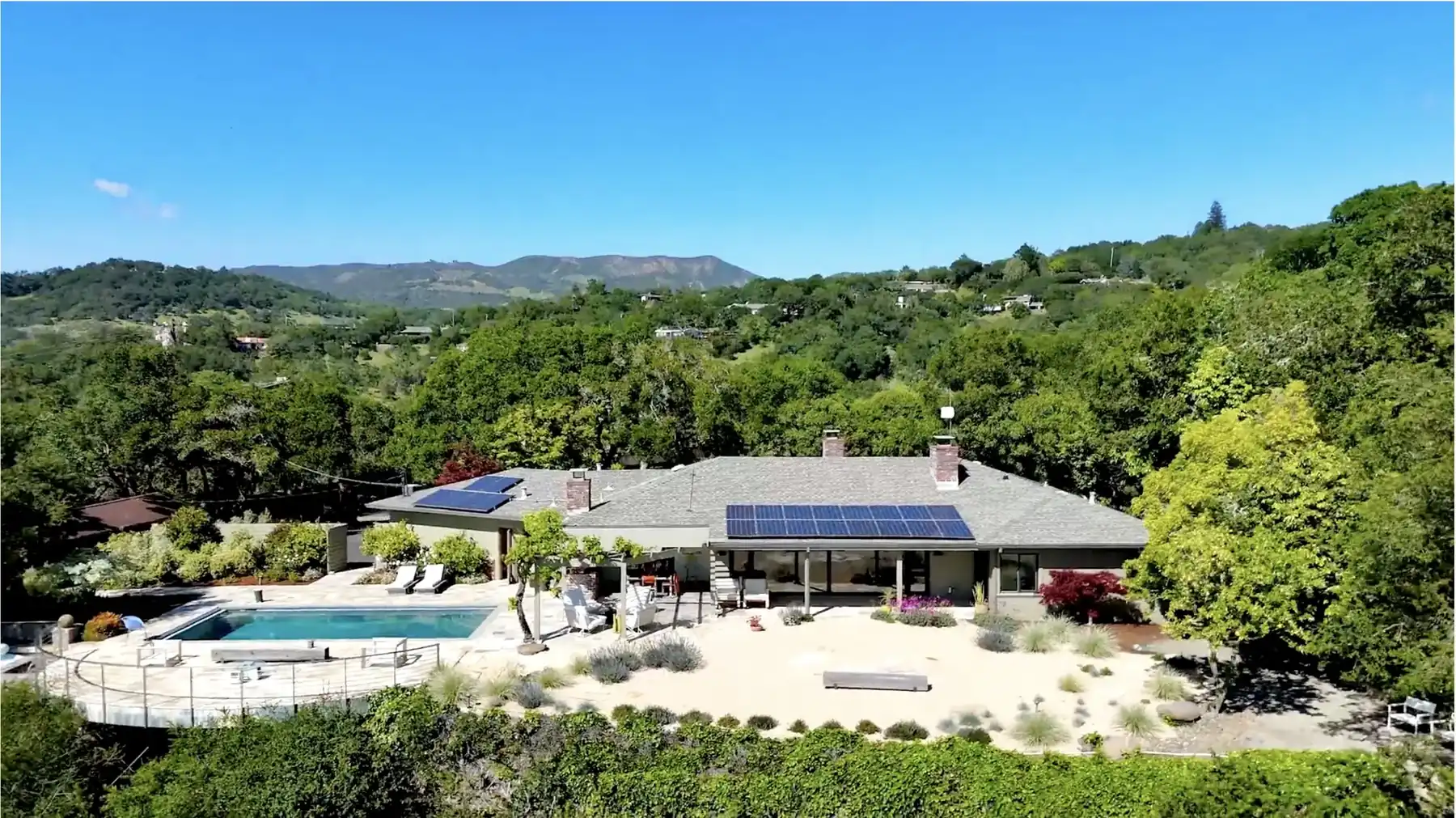 Aerial view of a mid-century hillside home with pool, Sonoma County
